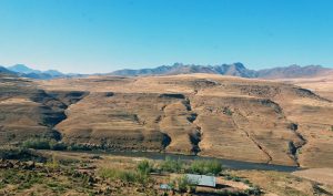 a mountain range with a river running through it